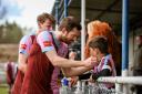 Hard to take: Dave Hodges consoles an unhappy Corinthian Casuals fan        Picture: Stuart Tree