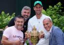 Novak Djokovic and his team, coach Goran Ivanisevic, Edoardo Artaldi, and Ulises Badio, holding the Gentlemen's Singles Trophy