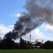 Plumes of smoke above the Baitul Futuh mosque